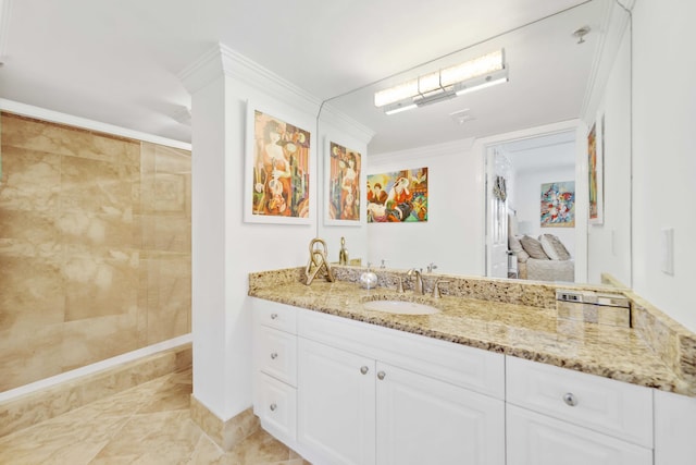 bathroom featuring ornamental molding and vanity