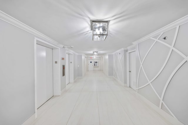 hallway featuring crown molding, elevator, and light tile patterned floors