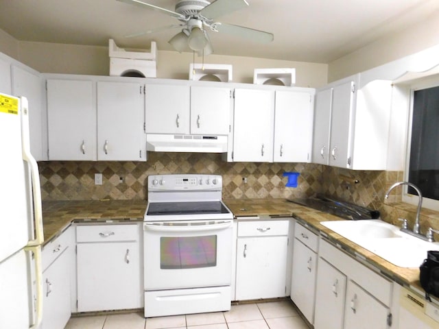 kitchen with sink, white appliances, decorative backsplash, and white cabinets