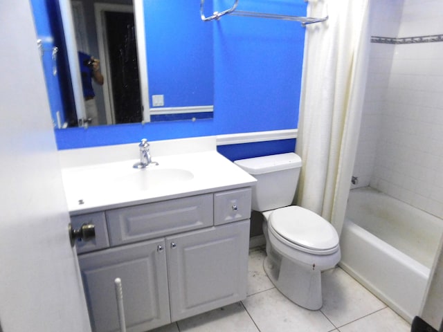 full bathroom with vanity, toilet, tile patterned flooring, and shower / tub combo