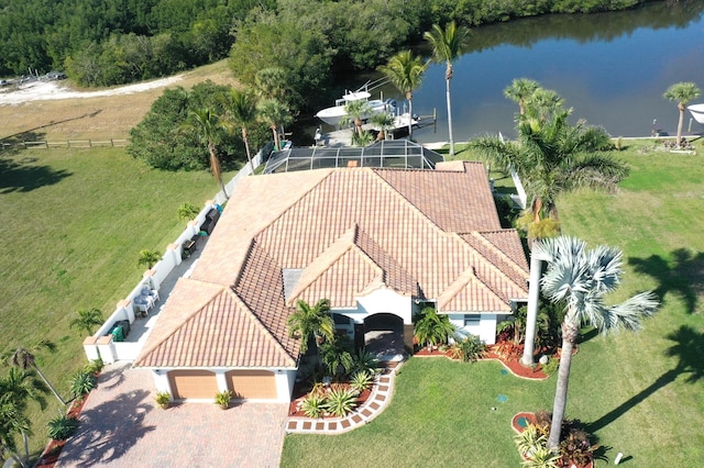 birds eye view of property with a water view