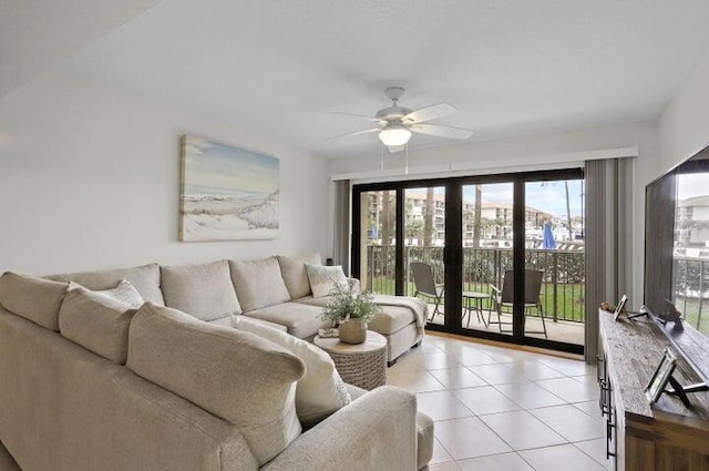 tiled living room featuring ceiling fan