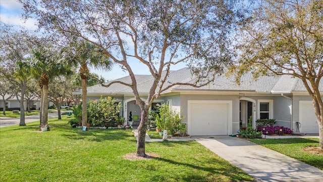 ranch-style home with a garage and a front yard