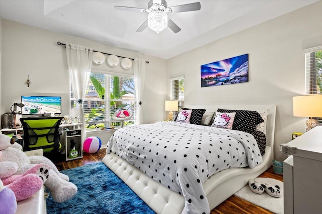 bedroom featuring dark hardwood / wood-style flooring and ceiling fan