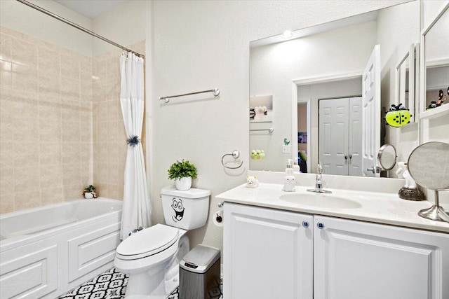 full bathroom with vanity, shower / tub combo with curtain, and toilet