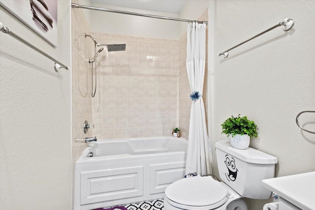 full bathroom featuring vanity, shower / bath combination with curtain, and toilet