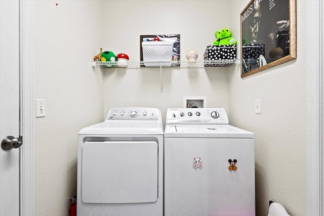 washroom featuring washer and dryer