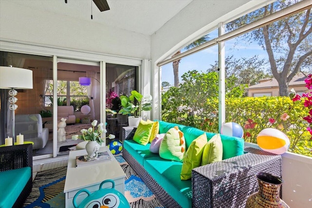 sunroom / solarium with ceiling fan