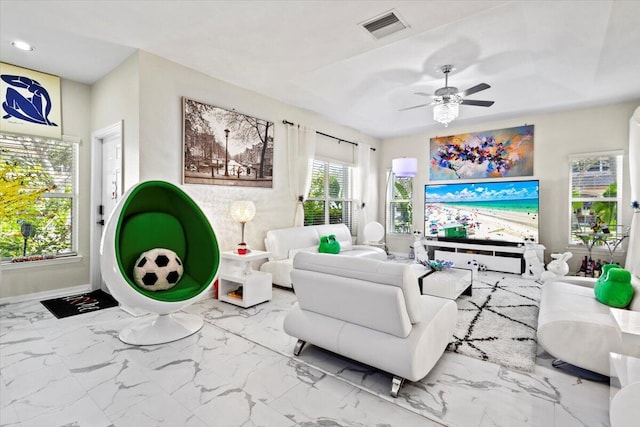 living room featuring ceiling fan