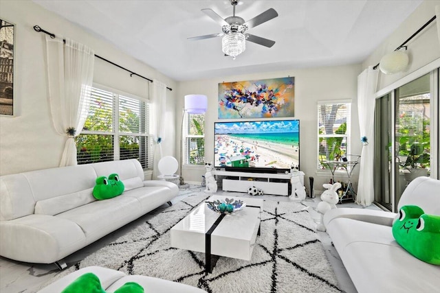 living room with plenty of natural light and ceiling fan