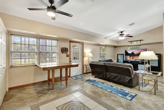 living room with light tile patterned flooring, lofted ceiling, and ceiling fan