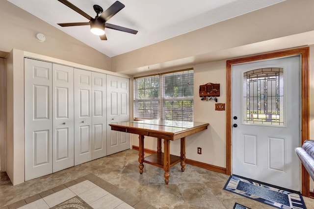 interior space with lofted ceiling and ceiling fan