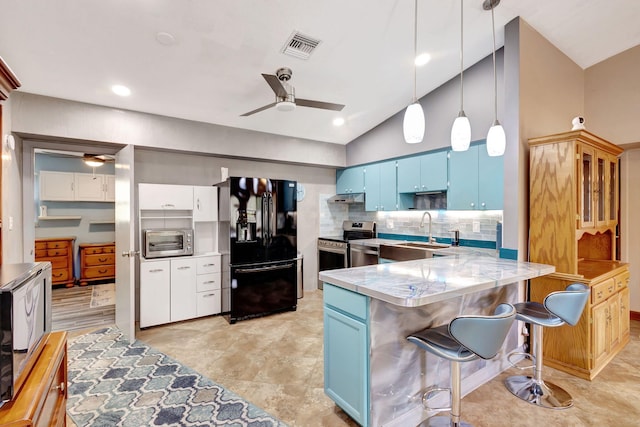 kitchen with sink, stainless steel electric range, blue cabinets, decorative light fixtures, and black refrigerator with ice dispenser