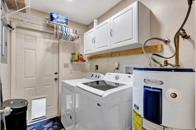 laundry area featuring cabinets, a textured ceiling, electric water heater, and washing machine and clothes dryer