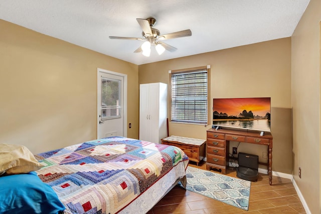 bedroom featuring wood-type flooring, a textured ceiling, and ceiling fan