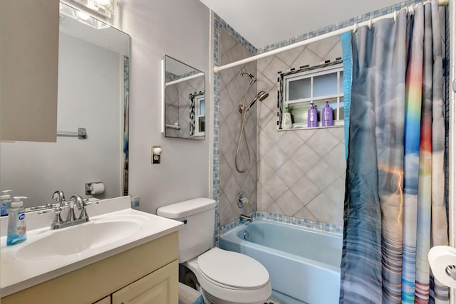 full bathroom featuring shower / bath combination with curtain, vanity, and toilet