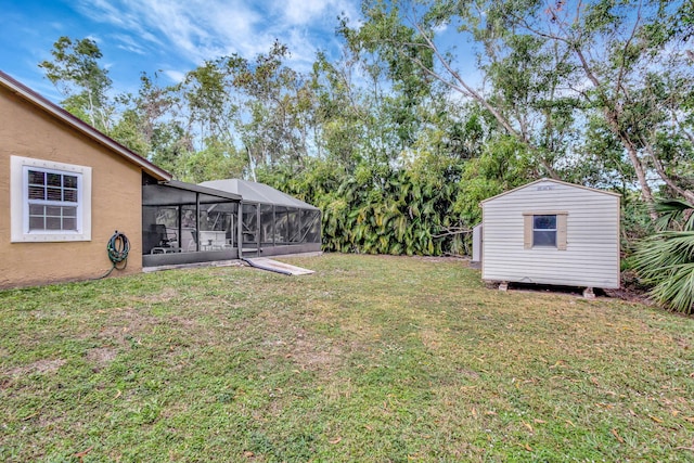 view of yard featuring a storage shed and glass enclosure