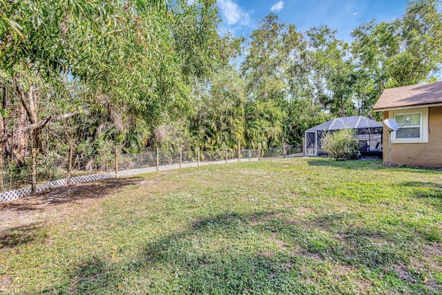 view of yard featuring a lanai