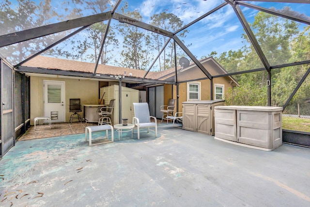 exterior space with a lanai and a storage shed