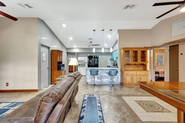 living room with high vaulted ceiling and ceiling fan