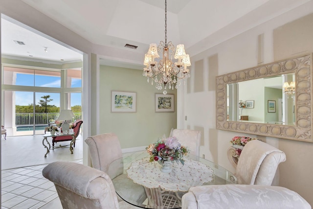 dining area with an inviting chandelier and a towering ceiling