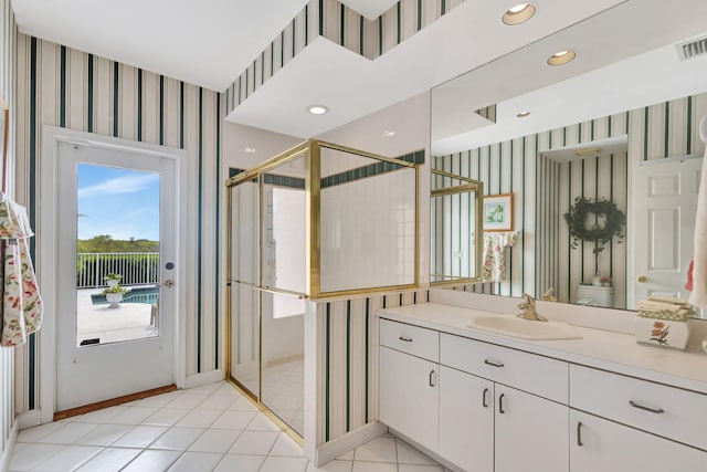 bathroom featuring an enclosed shower, vanity, and tile patterned flooring