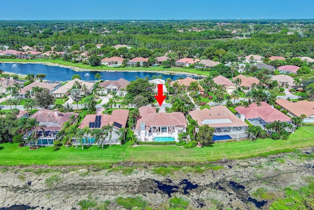 birds eye view of property with a water view