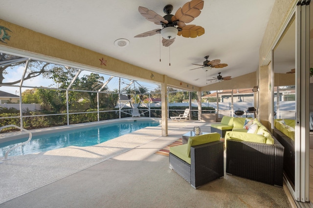 view of swimming pool with glass enclosure and a patio area