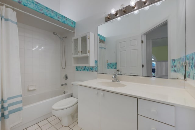 full bathroom with shower / tub combo, vanity, tile patterned floors, and toilet