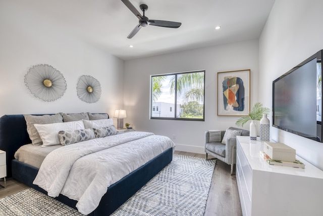 bedroom featuring ceiling fan and hardwood / wood-style floors