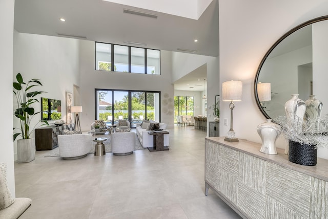 living room with a high ceiling