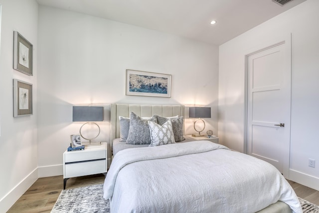 bedroom featuring hardwood / wood-style floors