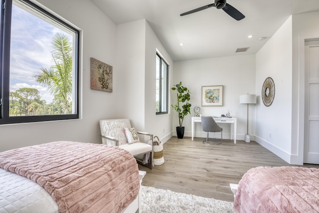 bedroom featuring ceiling fan and light hardwood / wood-style flooring