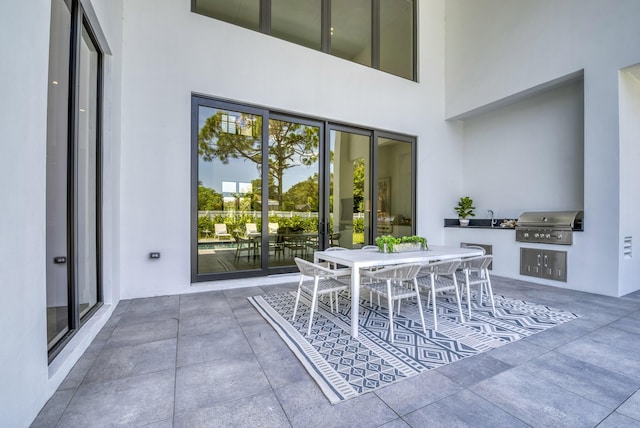 view of patio / terrace with an outdoor kitchen and area for grilling