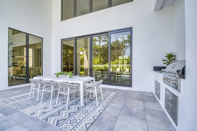 view of patio featuring area for grilling and an outdoor kitchen