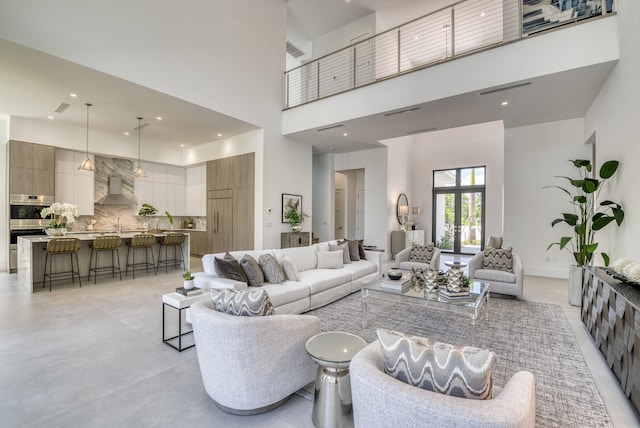 living room with a high ceiling