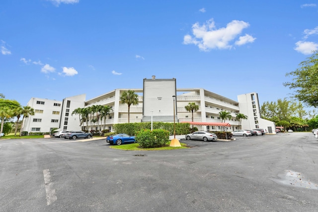 view of property with uncovered parking