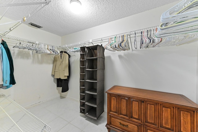 walk in closet with visible vents and light tile patterned flooring