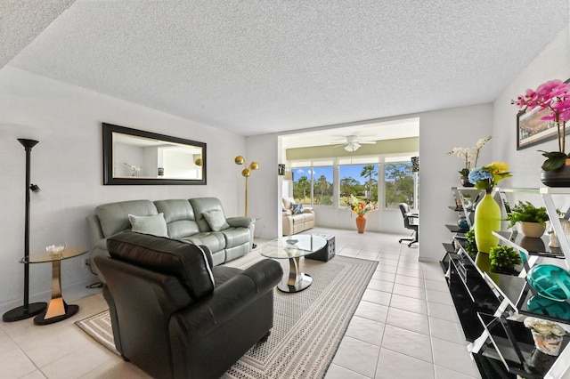 living area with a textured ceiling and light tile patterned flooring