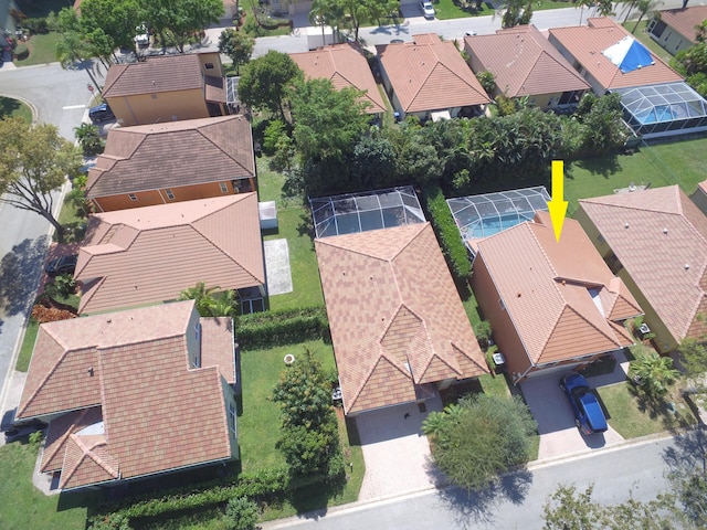 birds eye view of property with a residential view