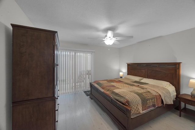 bedroom with ceiling fan, access to exterior, and light hardwood / wood-style floors