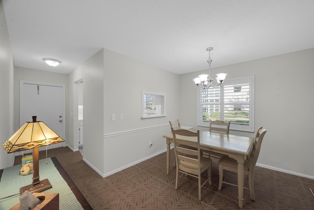 dining room with a notable chandelier