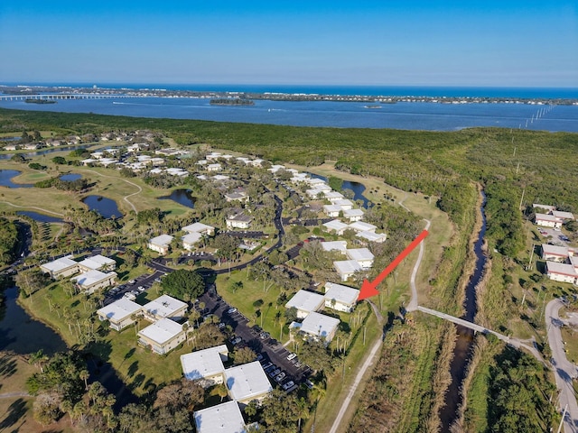 birds eye view of property featuring a water view