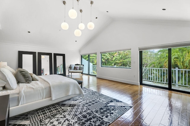 bedroom with high vaulted ceiling, hardwood / wood-style flooring, access to outside, and ornamental molding