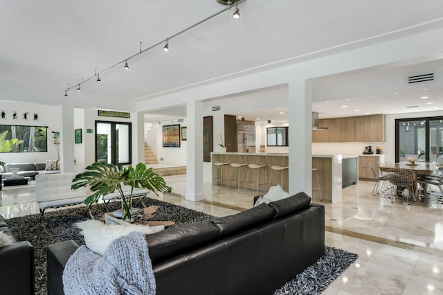 living room featuring track lighting