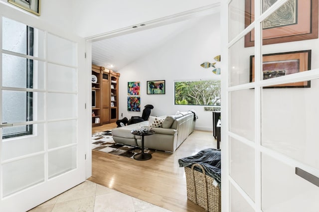 living room with hardwood / wood-style flooring and lofted ceiling