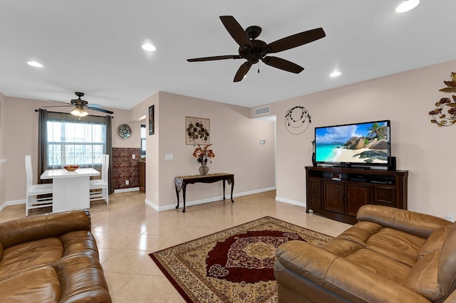 tiled living room with ceiling fan