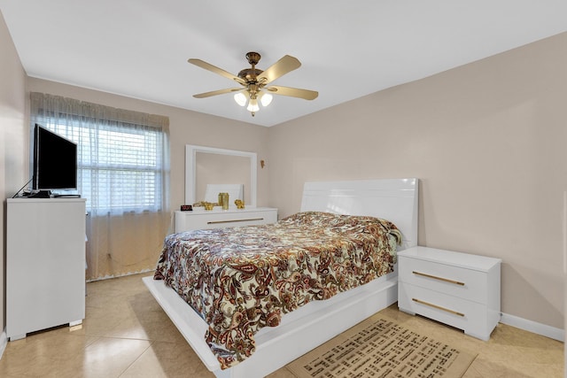 bedroom with light tile patterned floors and ceiling fan