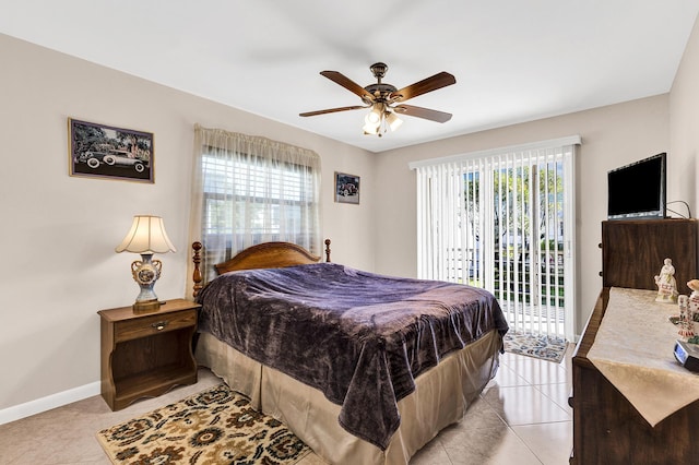 tiled bedroom with multiple windows, access to exterior, and ceiling fan