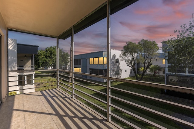 view of balcony at dusk